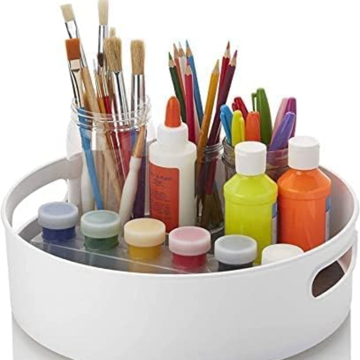 White round art organizer with paintbrushes, markers, and bottles on a white background