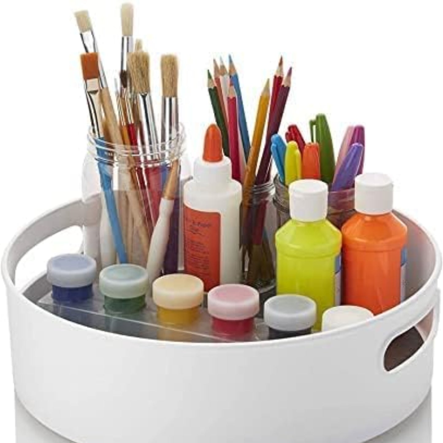 White round art organizer with paintbrushes, markers, and bottles on a white background