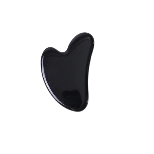 Black Gua Sha tool on a white background