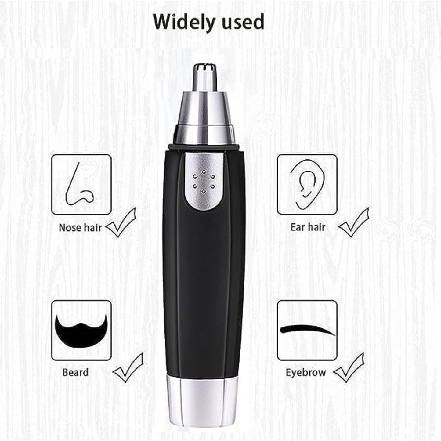 Black and silver electric trimmer with illustrations of nose hair, ear hair, beard, and eyebrow on a light wooden background.