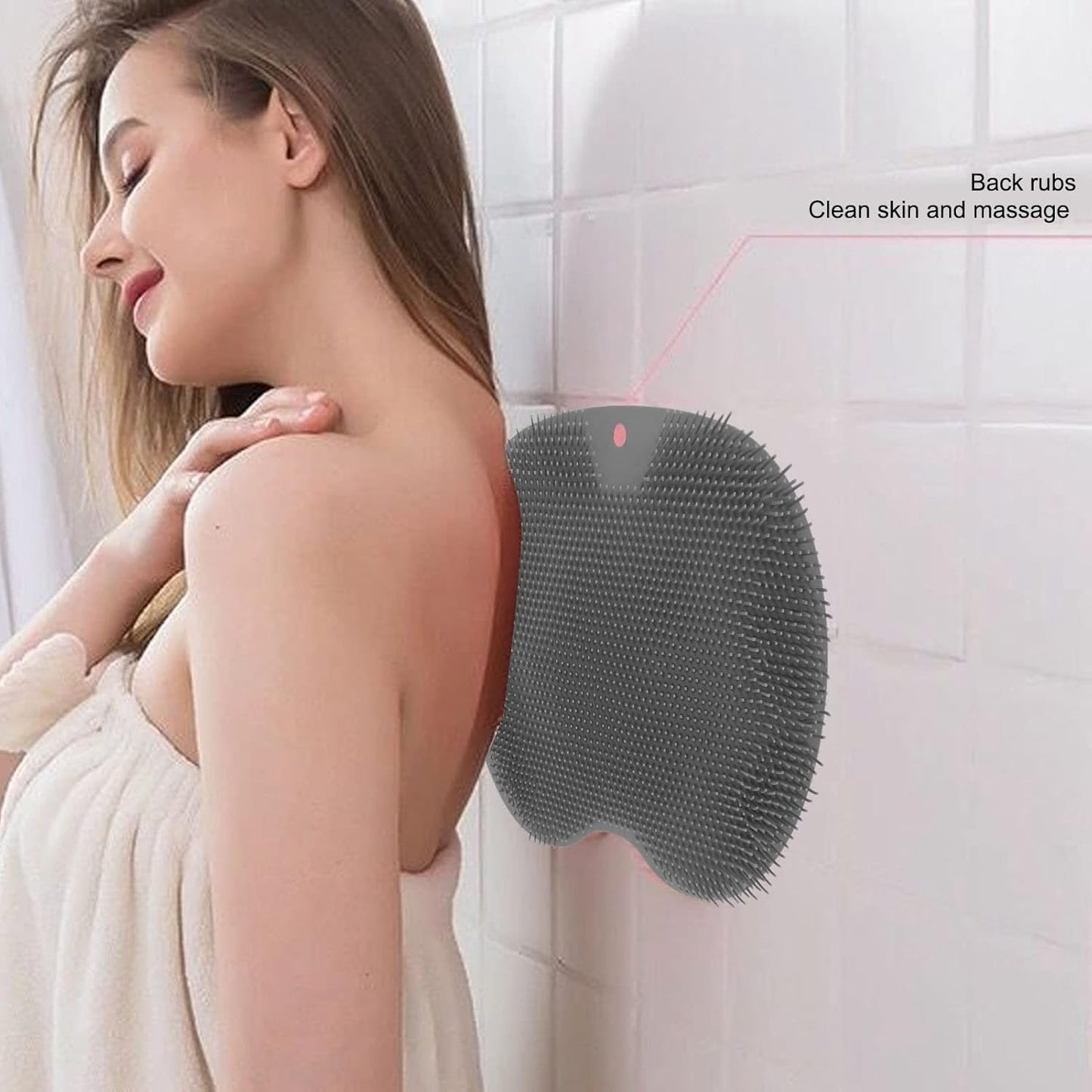 Woman using a back scrubber on a tiled bathroom wall grandsell