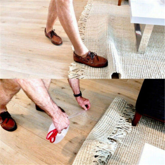 Person cleaning a wooden floor with a white cloth and red scissors.