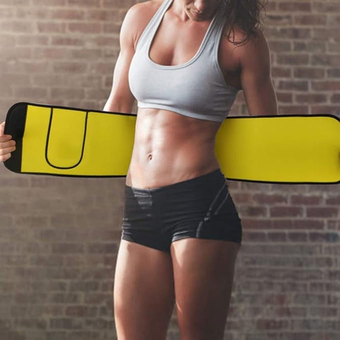 Person holding a yellow and black object against a brick wall